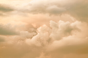 Pastel coloured colored evening cumulus sky clouds. Pink and grey gray colors colours