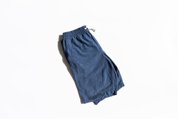 fold the men blue short pants isolated on white background.