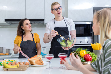 Family at the kitchen Happy face. Preparing family dinner at home. Happy smiling family having fun cooking at kitchen together. Family lifestyle. Happy together cooking on kitchen.