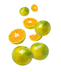 Tangerine orange fruit with cut half slice falling in the air isolated on white background.
