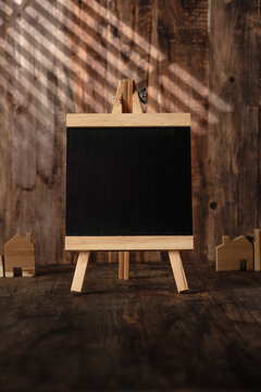 Blank blackboard with window sunlight shade on wood wall and table