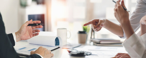 Business people discussing and giving advice business investment, financial and future planning deals in the office.