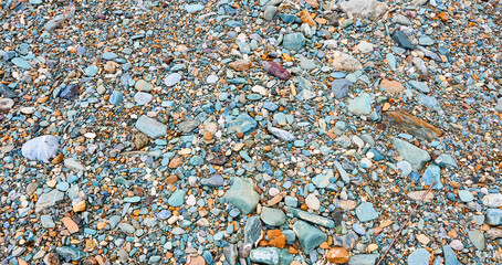 The stone embankment of the mountain river.