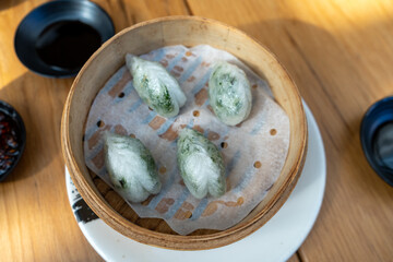 yumcha, dim sum dumplings in bamboo steamer, chinese cuisine