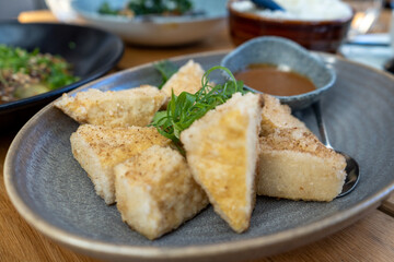 Salt and pepper fried tofu in a plate, Chinese cuisine
