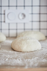 The process of making wheat bread at home. Dough shaping. The concept of healthy homemade food. Vertical photo.