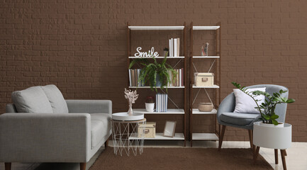 Interior of modern room with shelf units, sofa and armchair near brown wall