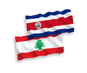 National vector fabric wave flags of Republic of Costa Rica and Lebanon isolated on white background. 1 to 2 proportion.