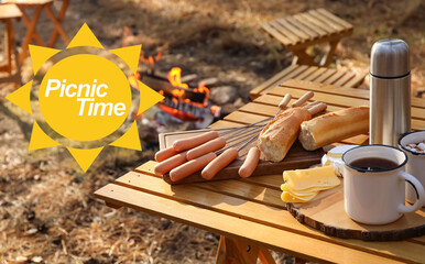 Tasty snacks with hot tea on table in forest. Picnic time