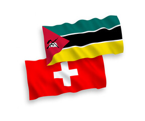 National vector fabric wave flags of Republic of Mozambique and Switzerland isolated on white background. 1 to 2 proportion.