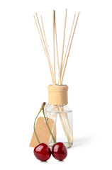 Reed diffuser and cherry on white background