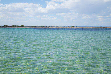 Coastal town seen from clear water