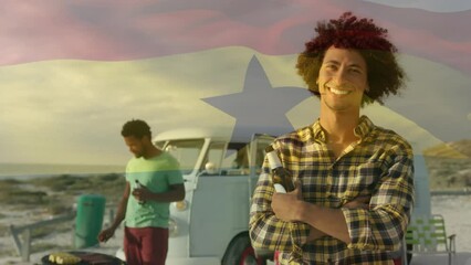 Animation of waving ghana flag over group of diverse friends on the beach - Powered by Adobe