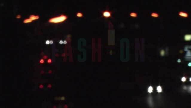 Animation of fashion style appearing over blurred night city traffic