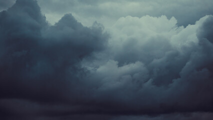 Storm sky with dark grey cumulus clouds.  Thunderstorm