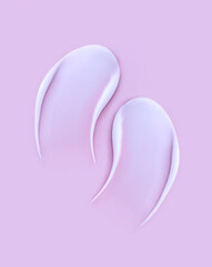 cosmetic smears cream texture on pink background