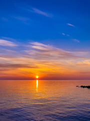 Calm sea with sunset sky In Sochi