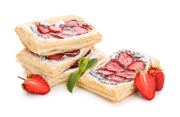 Strawberry puff pastries with sugar powder and mint leaves on white background