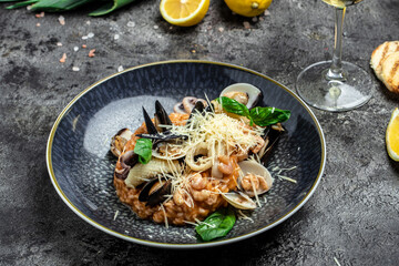 Italian risotto with shrimps, mussels, octopus, clams. Mediterranean cuisine. Restaurant menu, dieting, cookbook recipe top view