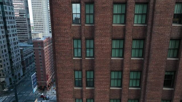 Apartment and office building reveal to street traffic below. Life in urban USA city.