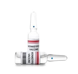 Ampules of monkeypox vaccine on white background