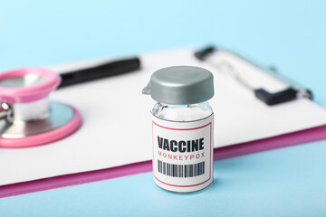 Monkeypox vaccine on blue background, closeup
