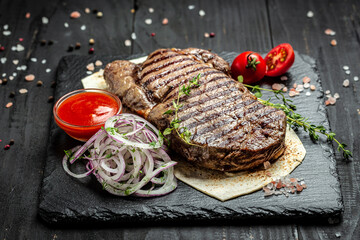 Medium rare Ribeye steak or beef steak. Dry Aged Barbecue Ribeye Steak beef steak sliced with large fillet piece. banner, menu, recipe place for text, top view