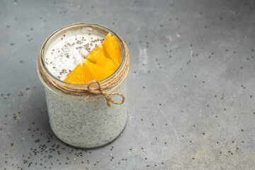 Obraz na płótnie Canvas Healthy breakfast. Chia seed pudding. Yogurt with chia seeds healthy superfood. Cottage cheese smoothie in glass jars. place for text