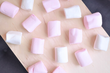 Close up of pink and white fluffy marshmallows sweet candy for tea and coffee break