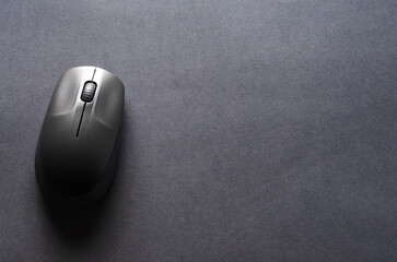 Computer keyboard and mouse on a black background. Copy space