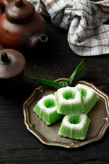 Kue Putu Ayu, Indonesian Traditional Jajan pasar made from Steamed Flour and Grated Coconut. Served with Tea