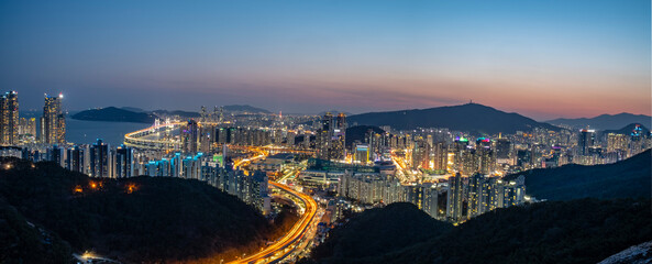Scenic view of cityscape against sky during sunset