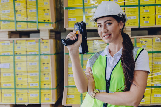 Staff lady worker work in warehouse inventory products collection management with barcode scanning device.