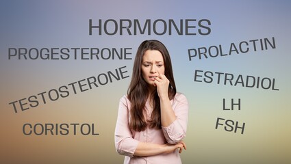 Hormones imbalance. Stressed young woman posing on a background