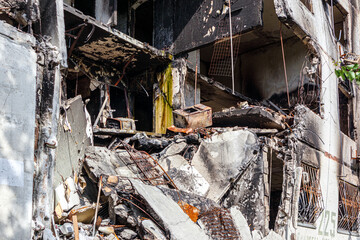 Destroyed and burned apartments in a multi-storey residential building. Residential area Saltovka....