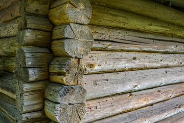 old wooden wall made from logs pattern corner of the house