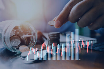 businessman holding coins putting in glass. concept saving money for finance accounting