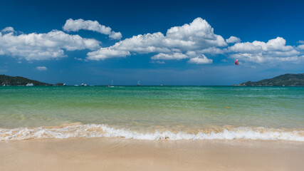 Fototapeta na wymiar Water splash at. the tropical beach, Located pathong beach Phuket, Thailand
