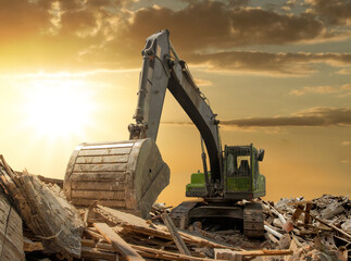 Powerful crawler excavator demolishes an old building