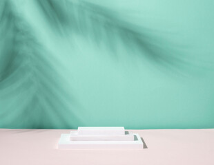 Abstract podium pedestal from white marble, blue menthol empty background deep shadows from plant