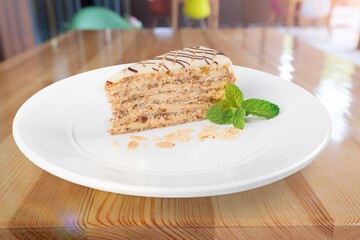 A piece of sponge cake decorated on a plate