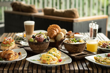 many mixed western breakfast food items on cafe table - 513674512