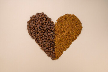 Abstract coffee concept. Ground, instant coffee and coffee beans in heart shape on warm, neutral...