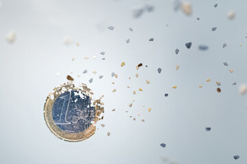 1 Euro coin breaking into pieces