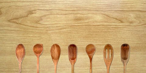 Topview of Set Cooking Wooden Spoons on Table Background