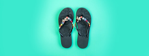 flip flops on a blue background. Beach slippers close-up. Upcoming vacation. Banner for insertion...