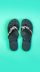 flip flops on a blue background. Beach slippers close-up. Upcoming vacation. Vertical image