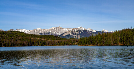 Pyramid Lake. Jasper National Park mountain range landscape, panoramic view. Canadian Rockies nature scenery background. Alberta, Canada. Mount Colin, Hawk Mountain.