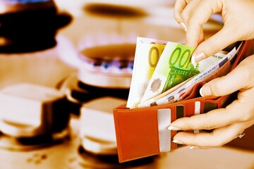 ÐŸas stove with a euro banknote of in hand, Concept of gas increases Europe.