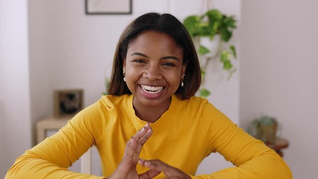 POV of young beautiful hispanic latin woman talking to the camera on video call - Portrait of cheerful african american teenager girl during chat video conference at home